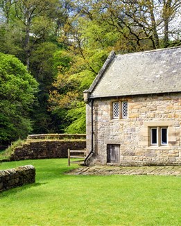 Watermill standing by a river