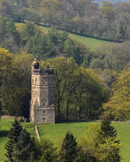 A stone tower on a hilltop