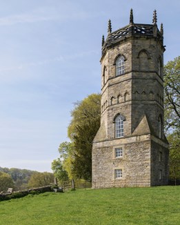 A stone tower on a hilltop