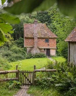 Medieval cottage in a woodland clearing