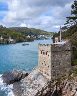 A square castle on rocks at the coast