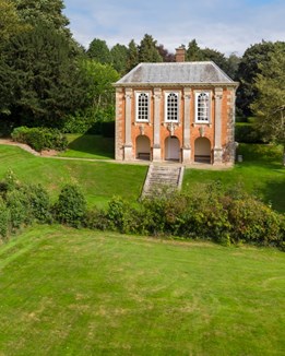 Georgian building overlooking green lawn