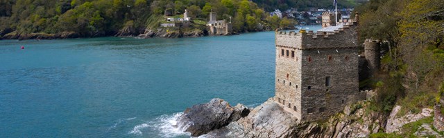 A castle fort on a rocky outcrop by the sea