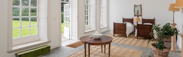 Two beds in an orangery