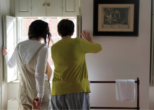 Princelet Street women looking out of window 450x321