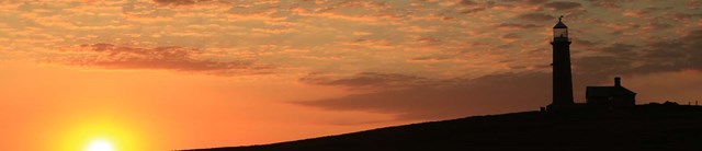 Lundy-exterior-sunset-1500x345