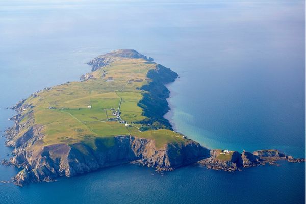 A bird's eye view of an island surrounded by the sea