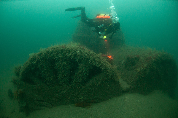 Diver photographing Iona II wreck site in the waters around Lundy