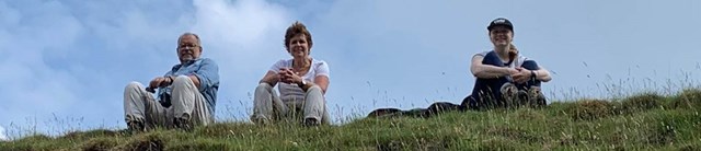 Caroline and her husband and daughter sit for a rest while walking the Dales