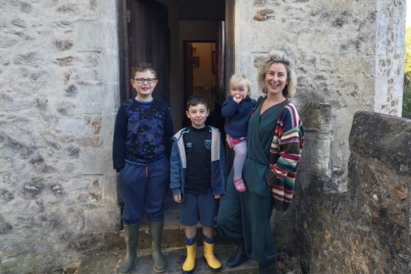 Writer and Landmarker Anna Shepard and family stood outside the front door of Shute Gatehouse, Dorset