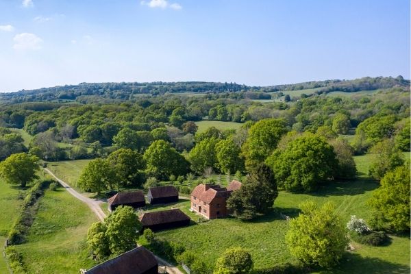 Aerial view of Obriss Farm in Kent surrounded by woodland