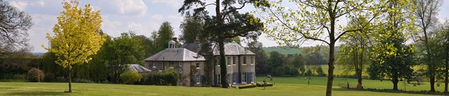 Cavendishhall-external-fullhousebehindtrees-1600x345