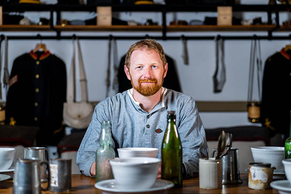 Crownhill Fort Manager Ed Donohue sat at the dining table