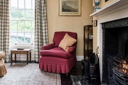 ironbridge-interior-armchariandfire-600x400
