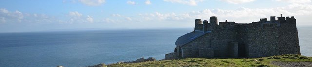 Low-lying castle looking out to sea
