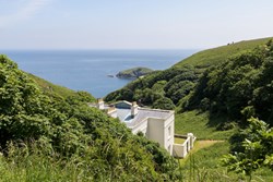 Millcombe-exterior-main-with-sea-view-600x400