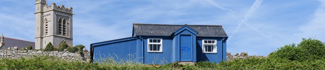 Old-School-exterior-view-with-church-1600x345