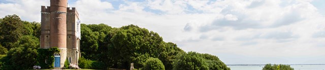 LuttrellsTower-exterior-withsea-1600x345