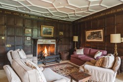 Old Parsonage int sitting with fire angle 1200x800