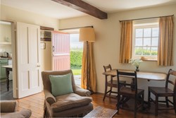 Paxton's Tower Lodge int sitting with door open 1200x800
