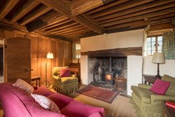priests house living room with fire 1200x800