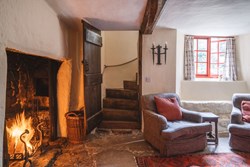 Sanders interior sitting with fire and stairs1200x800