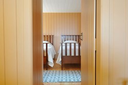 Shore Cottages 2 twin bedroom throrgh door 1200x800