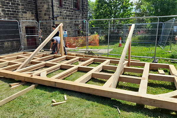 Calverley Old Hall SWAP Week 2 - timber frame construction - early stages on the ground.jpg