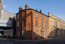 A red brick building on an urban city street